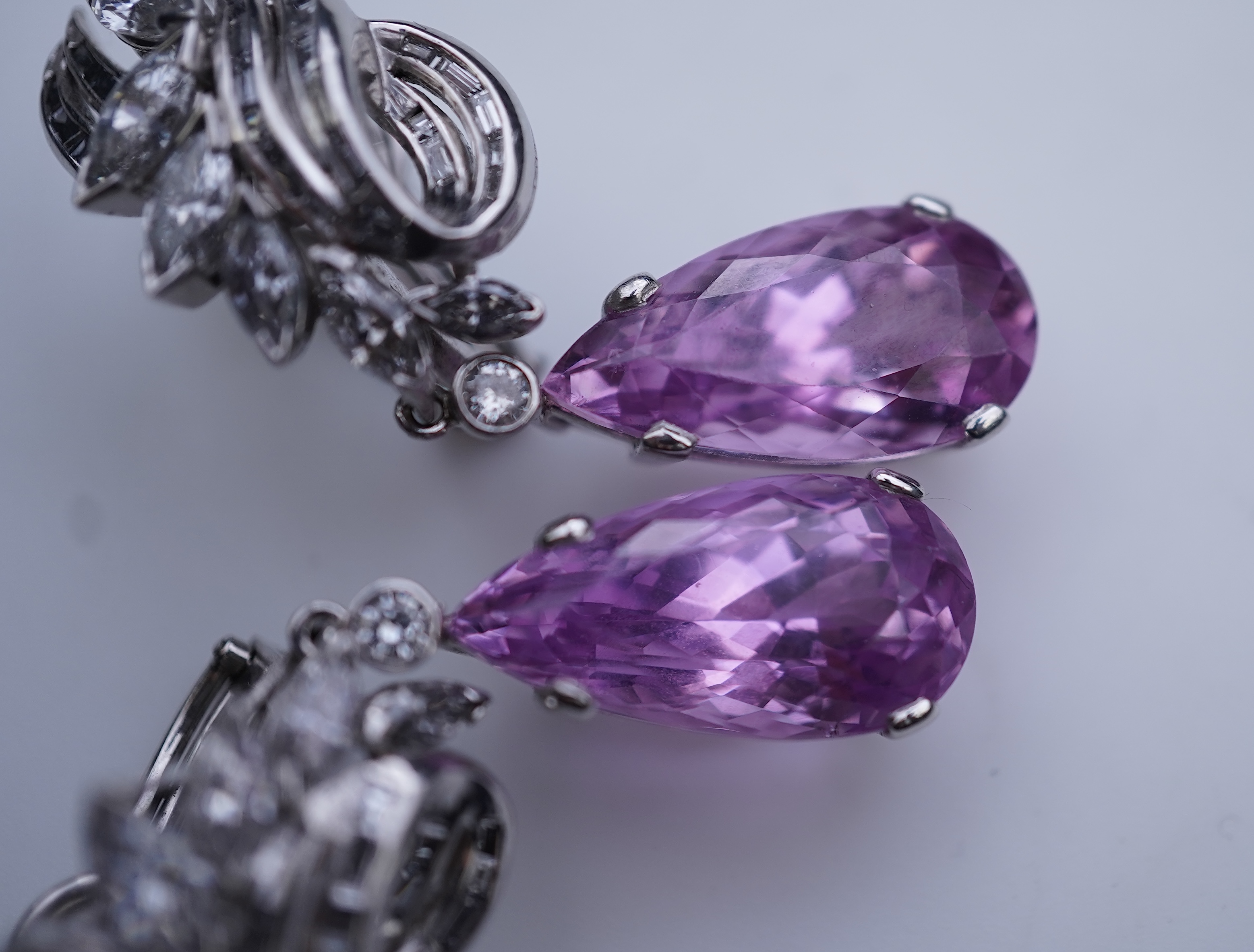 An attractive pair of 'day and night' kunzite and diamond ear clips